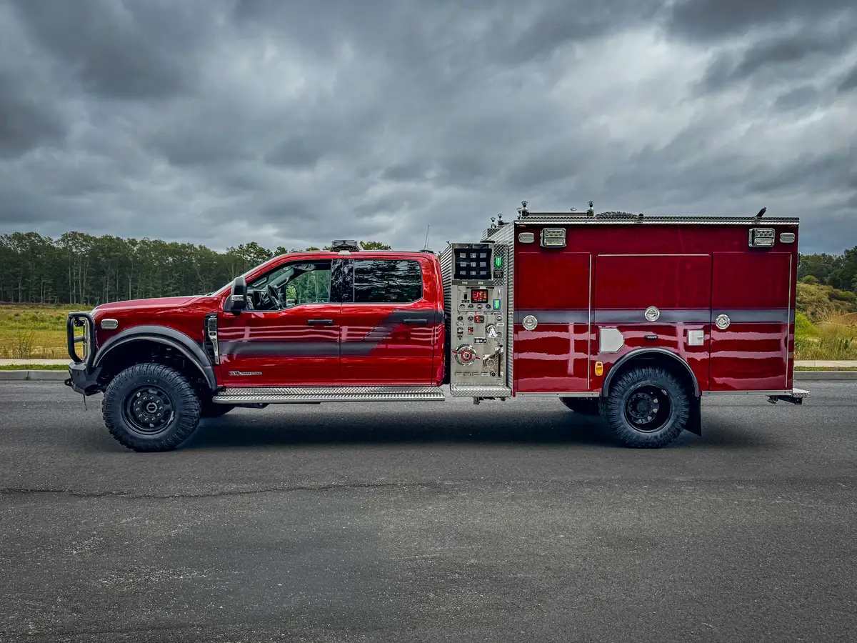 Left-side profile view showing crew cab, side body, and rear wheel area.